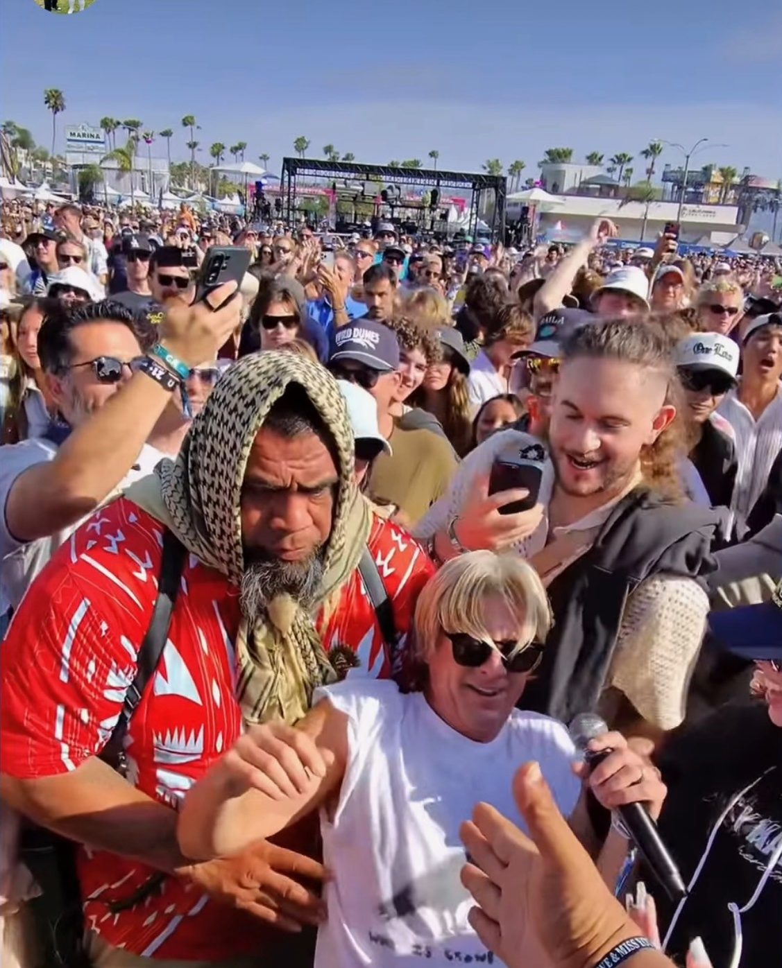 Aumaga team — Close escort through the crowd